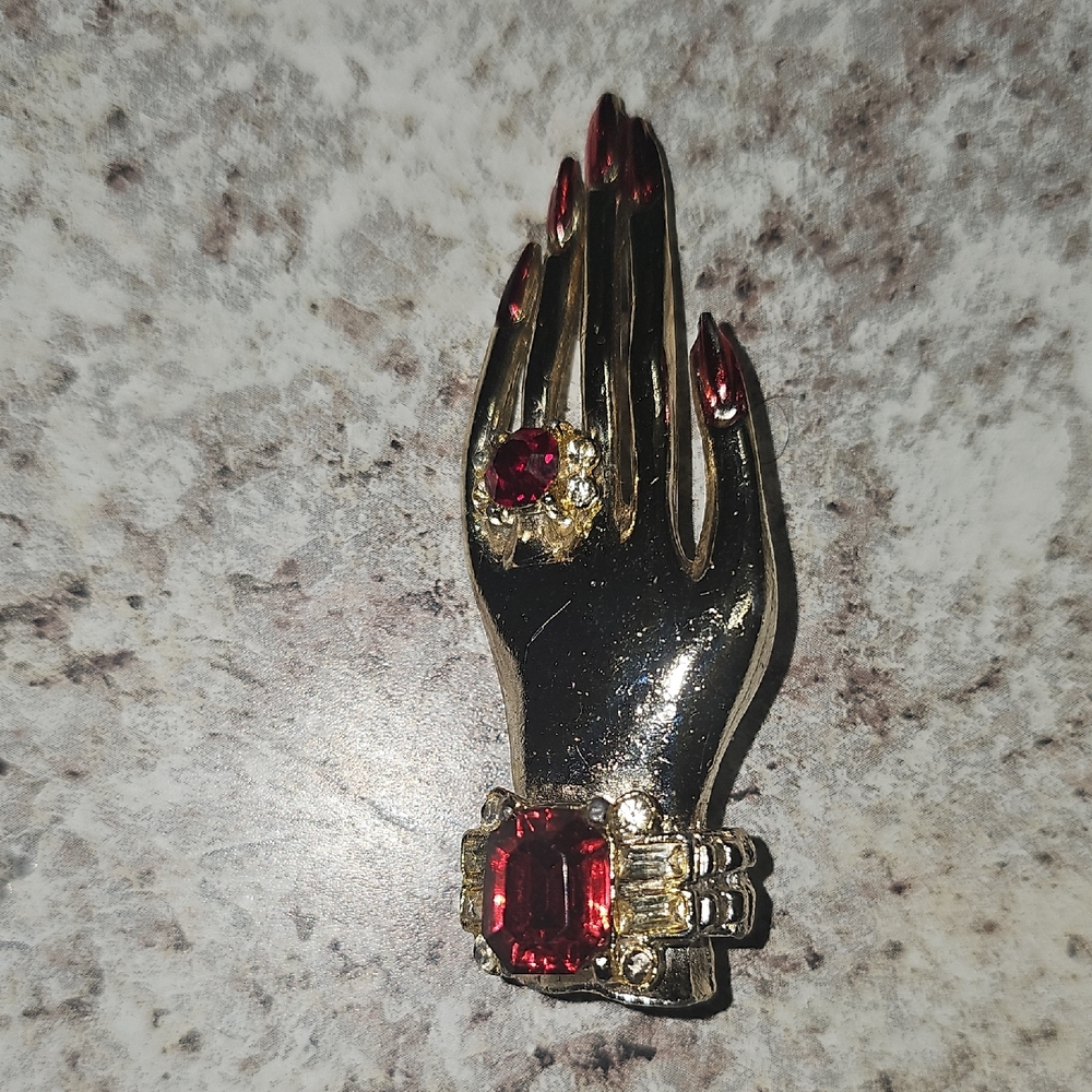 Elegant Gold and Red Hand-Shaped Brooch